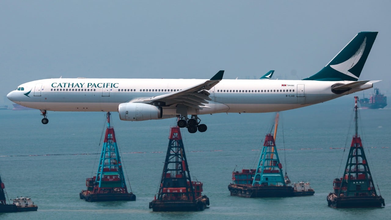 Hong Kong police arrest man over trying to open plane door on Cathay flight