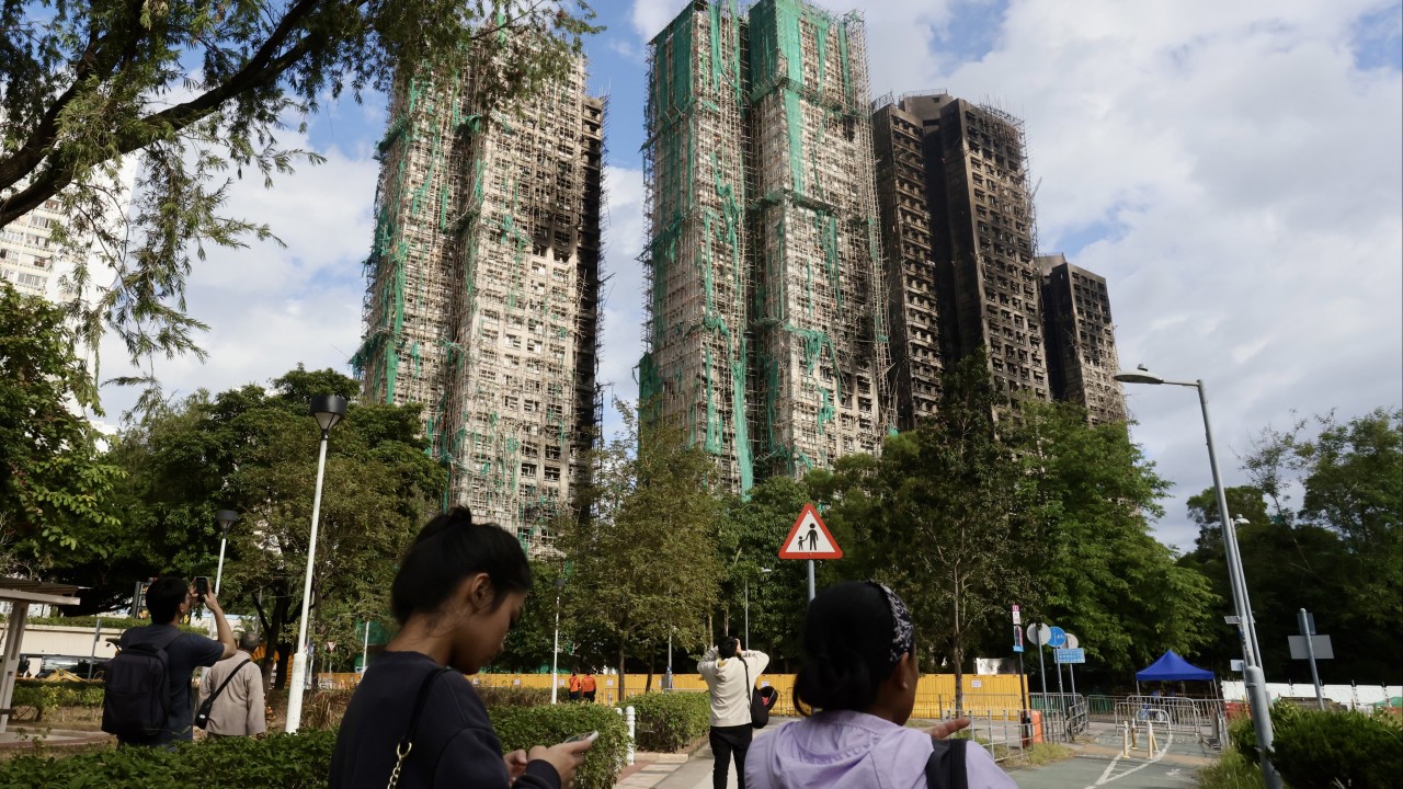 Hong Kong surveyor’s undeclared role prompts rule review after deadly Tai Po fire