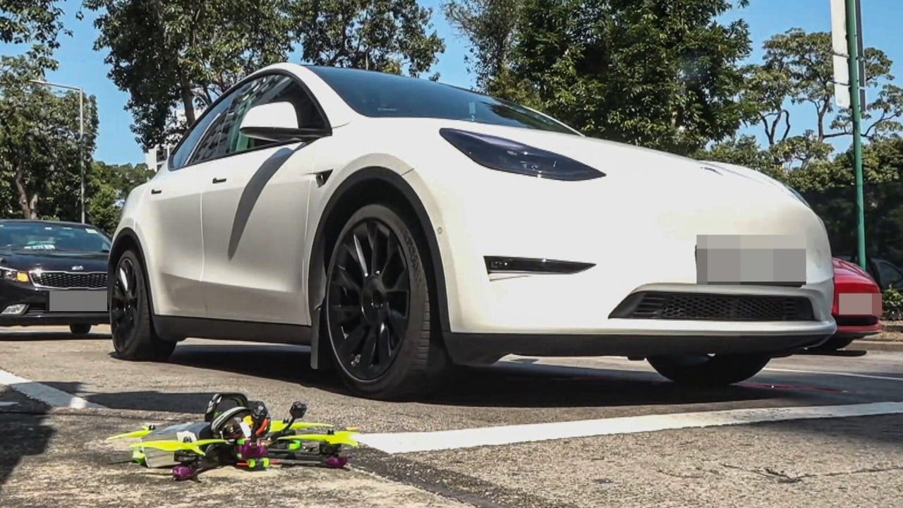 Hong Kong driver avoids injury after drone crashes onto Tesla roof