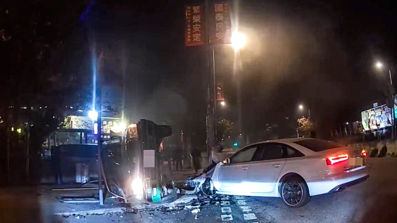Hong Kong woman dies after taxi overturns in crash