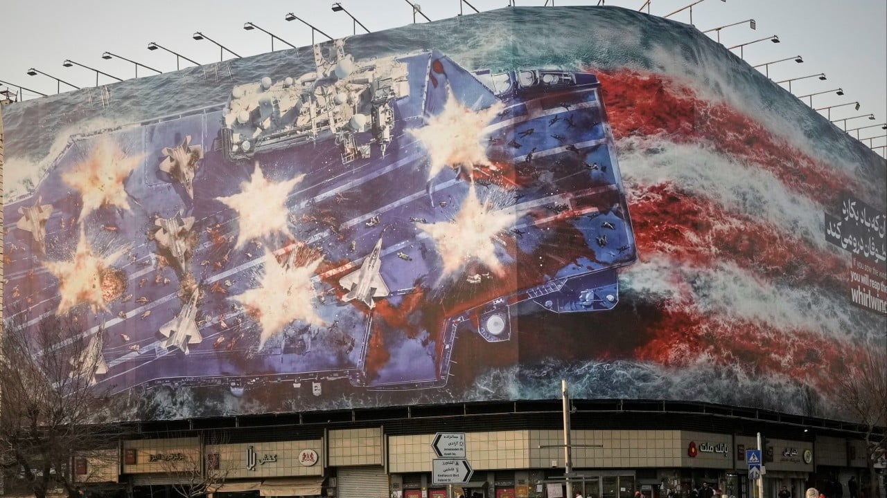 Iran unveils bloody anti-US billboard as carrier force nears