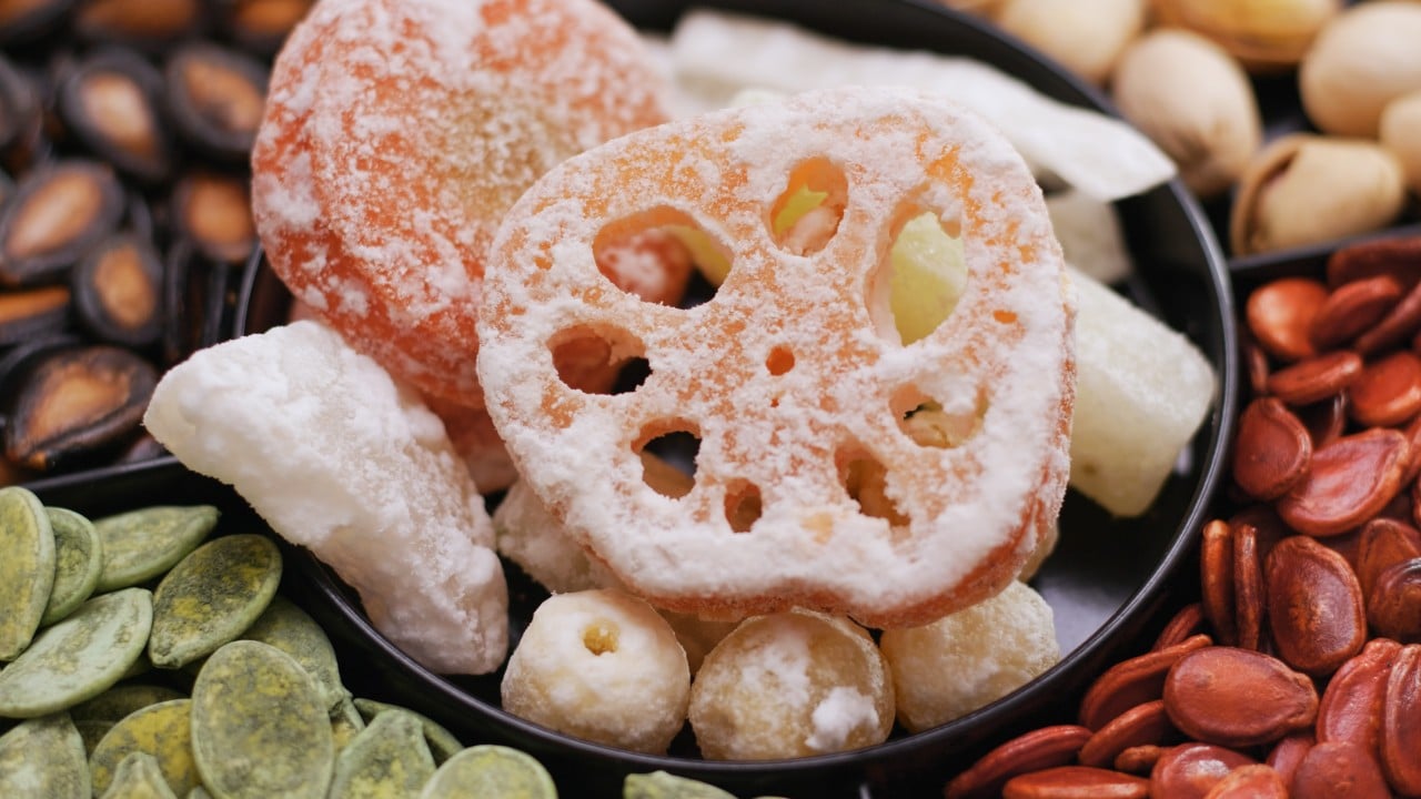 What common Lunar New Year snacks in China, Singapore and Malaysia symbolise