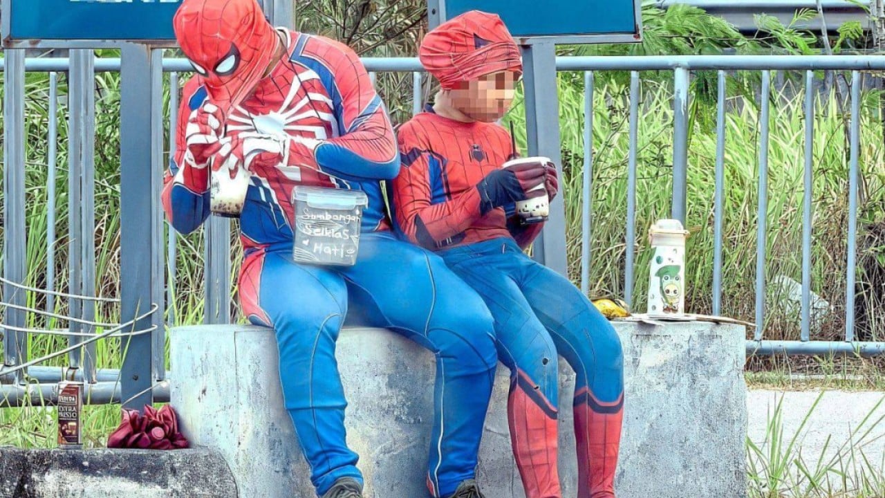 âSpider-Manâ beggar with girl sparks Malaysia child exploitation probe