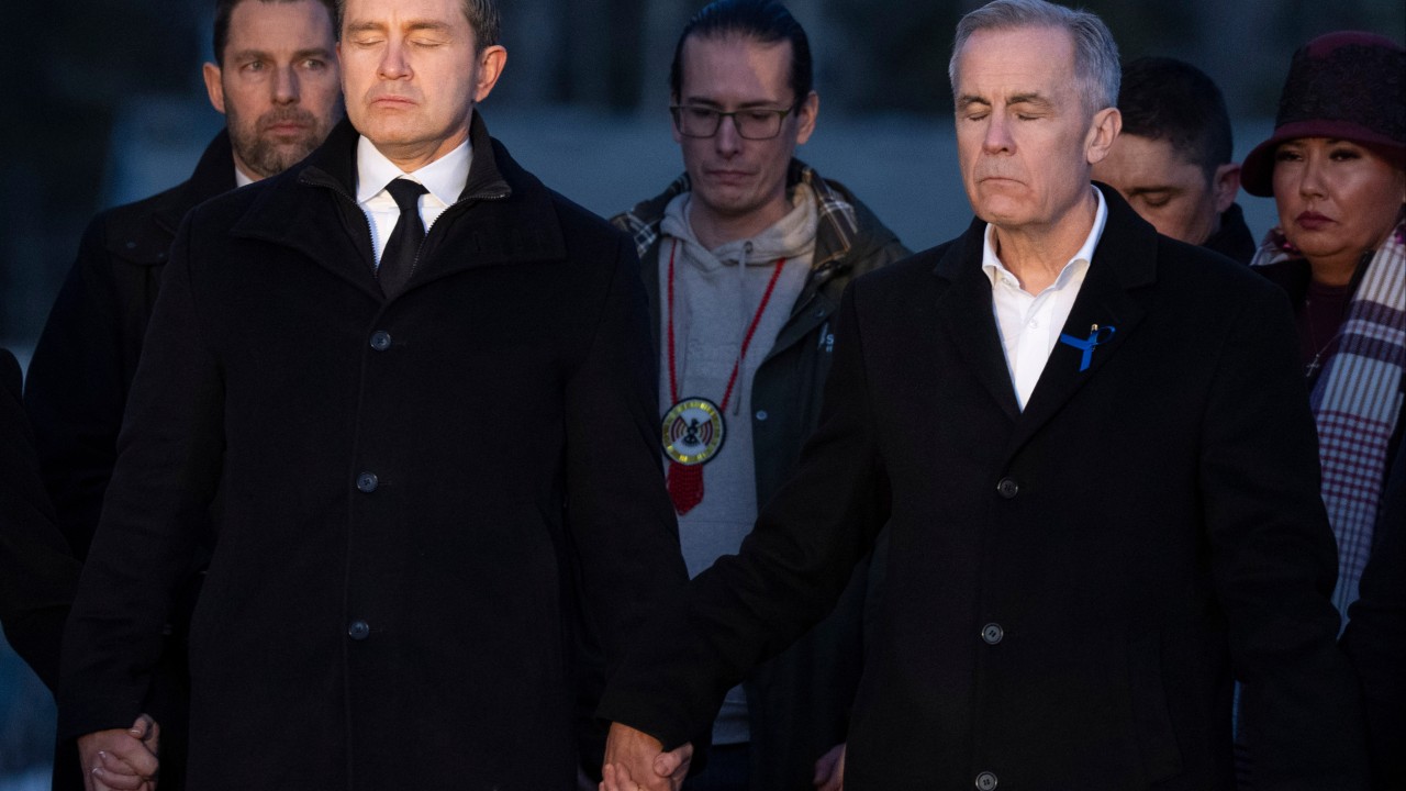 Canada’s Carney, opposition leader hold hands during school shooting vigil
