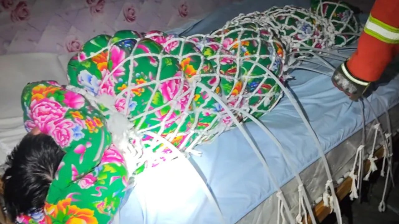 Chinese man rescued from ‘zip tie escape challenge’ after delivery man alerts police