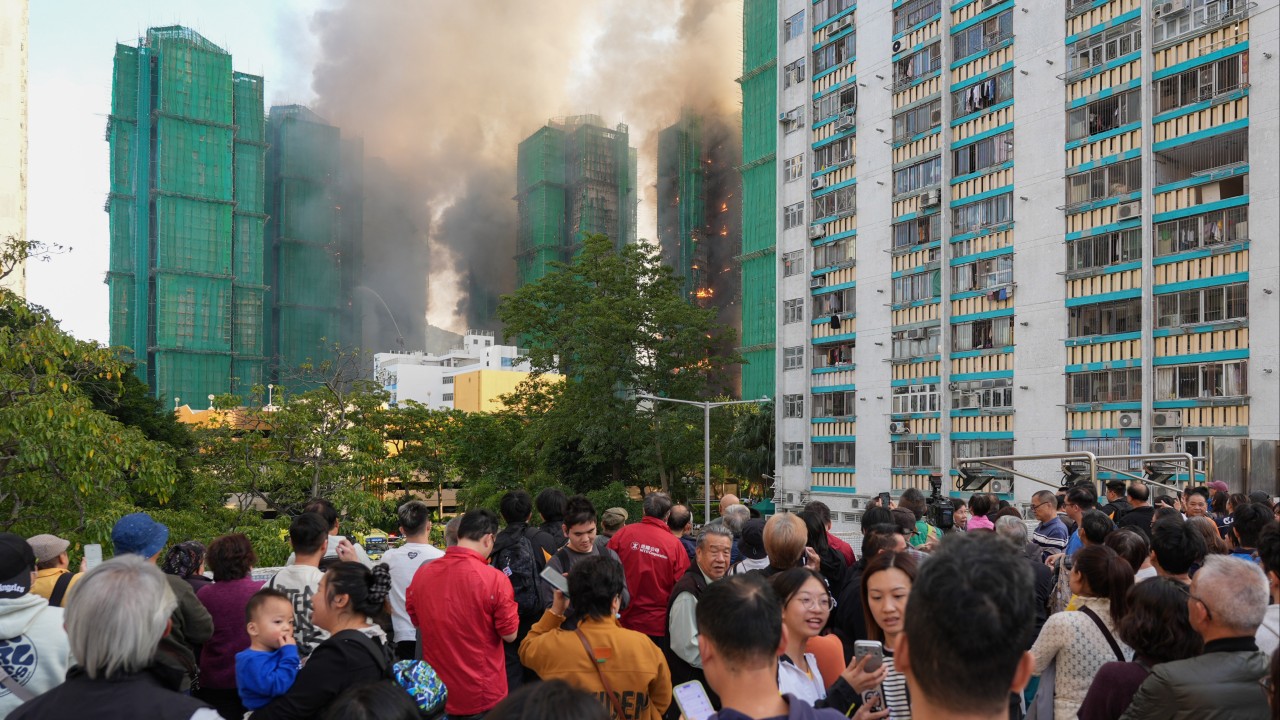 Tai Po fire survivors mourn heroine who alerted neighbours to flames