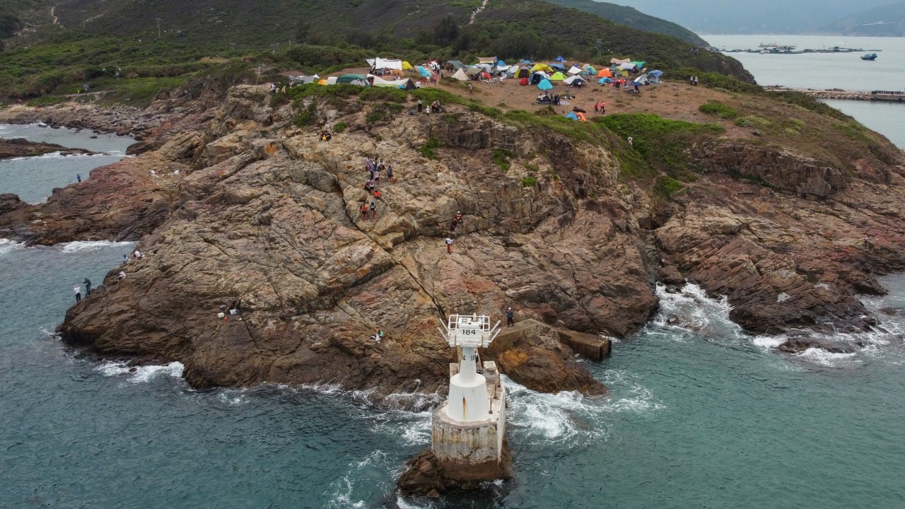 Woman rescued after falling into sea while taking photos at a Hong Kong lighthouse