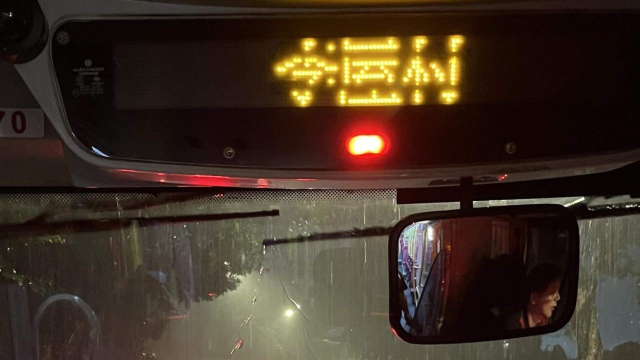 ‘Soaking wet’: Hong Kong parents furious after last-minute rain warning change