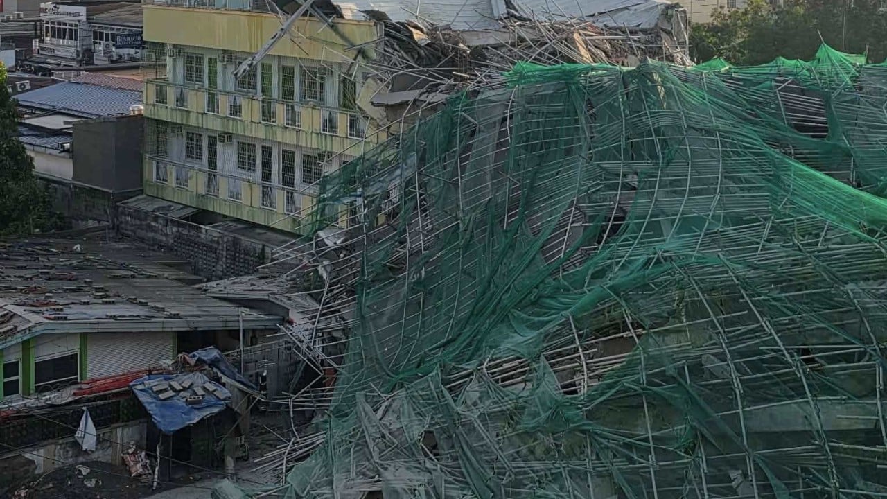 Unfinished Philippines building collapses, 21 missing, Malaysian tourist killed