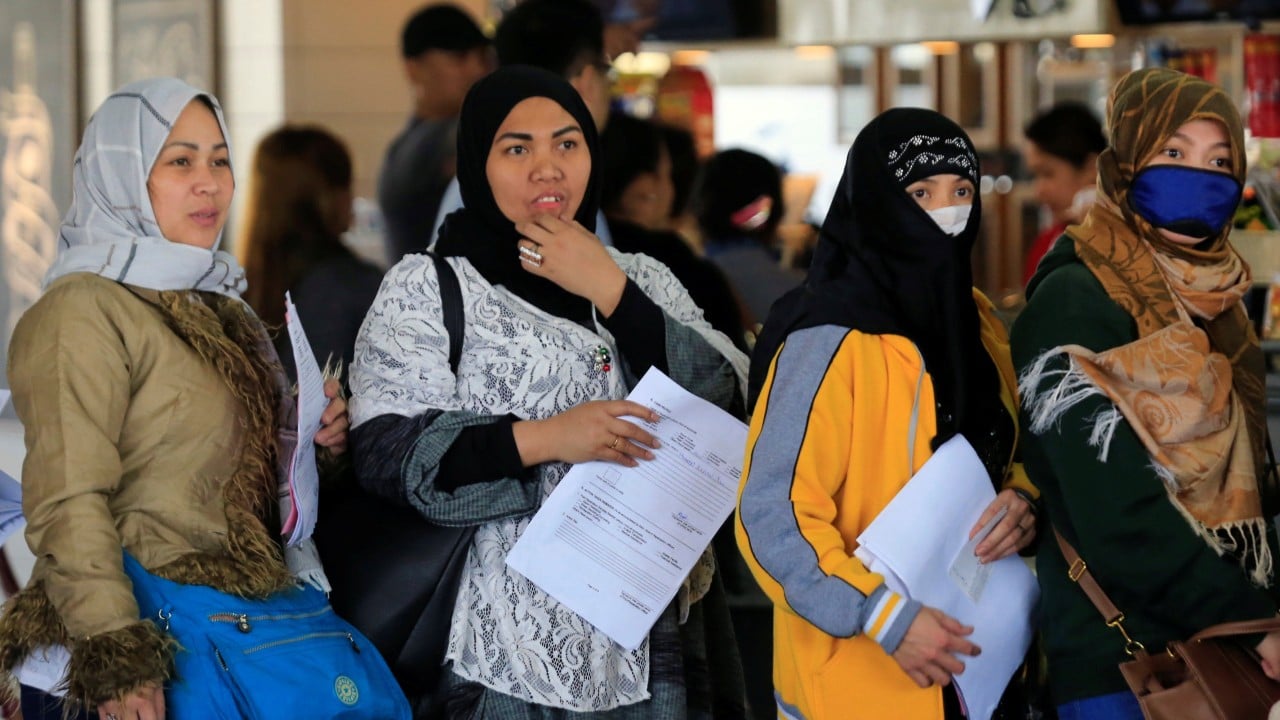 Homesick Filipino migrants count cost of separation for a ‘better’ future