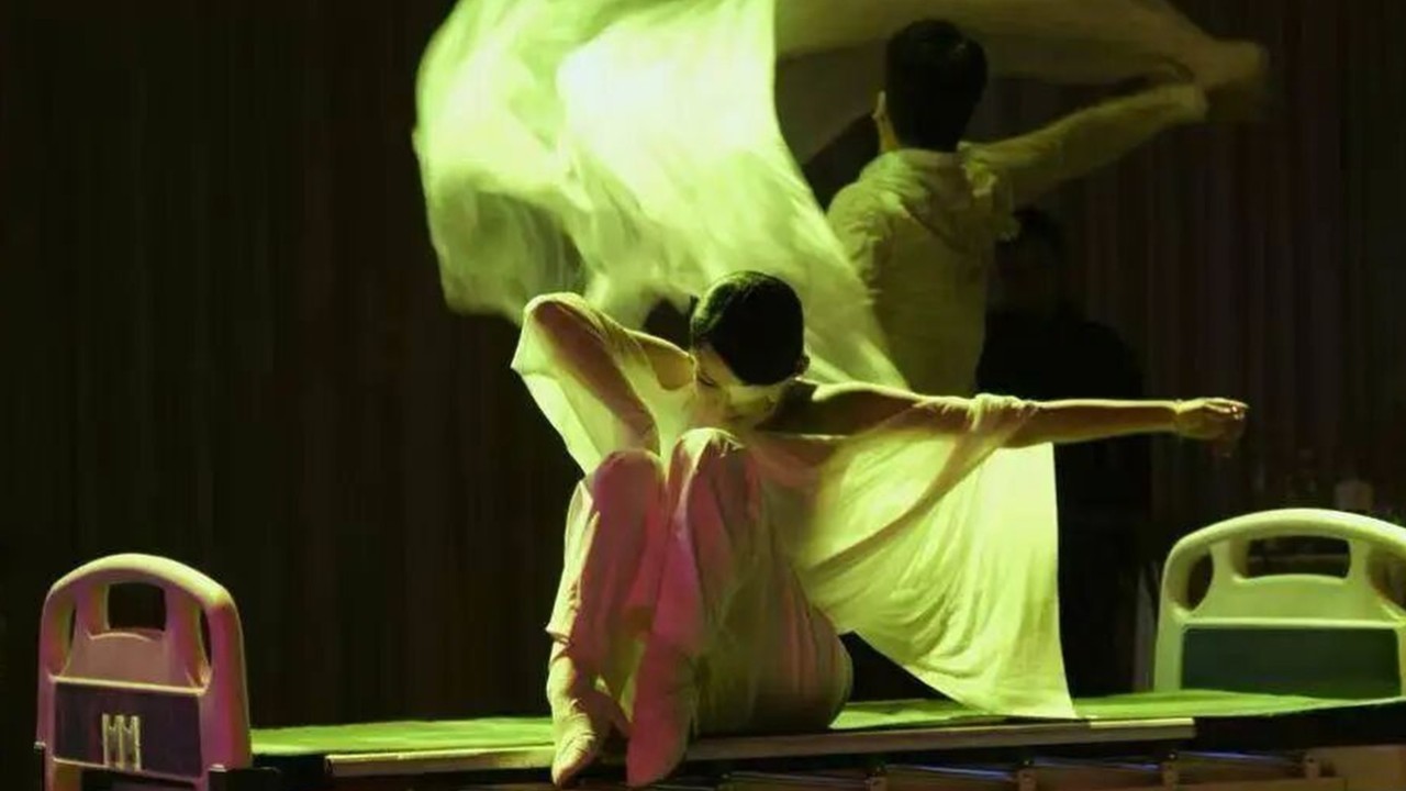 China woman dances with eye patch and mask after losing partial jaw, vision in one eye to cancer