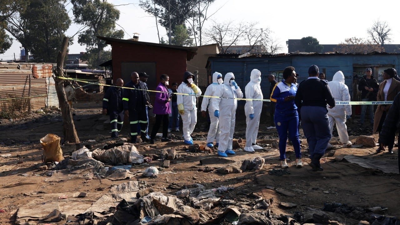 Manhunt in South Africa for attackers who killed 12 in mass shooting