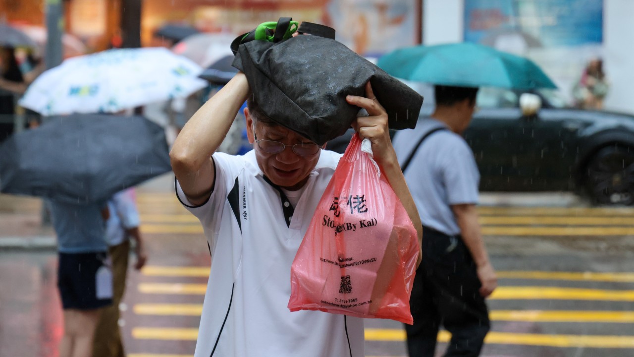 Hong Kong lowers black rainstorm warning to yellow after disruptions, flooding