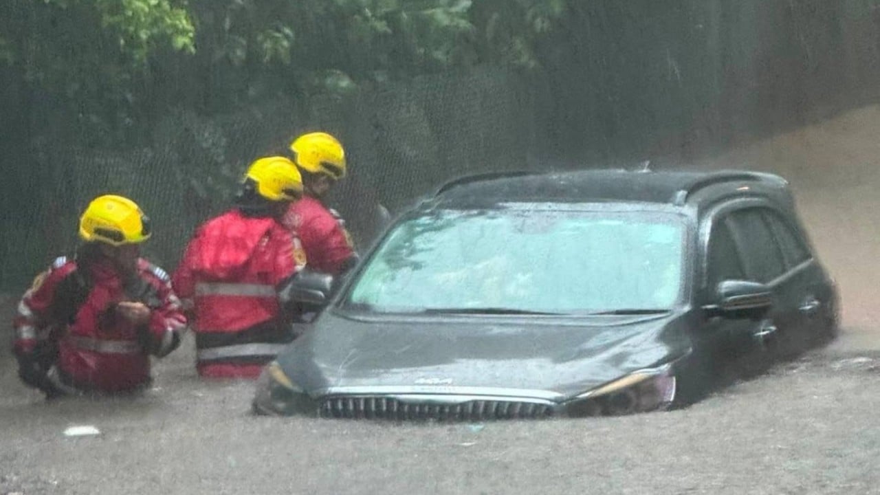 Hong Kong issues 2 black rainstorm warnings in 1 day as downpours hit city