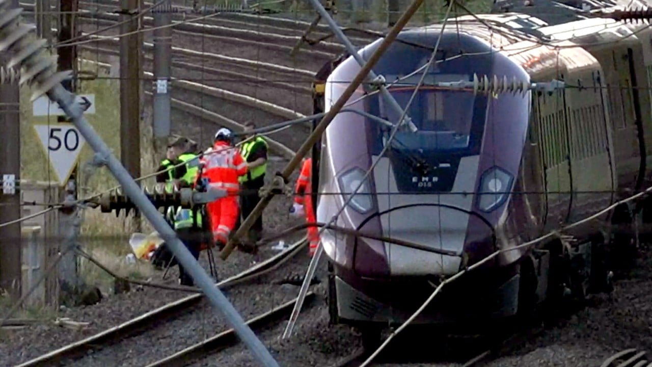 2 trains collide north of London, killing 1 and injuring dozens