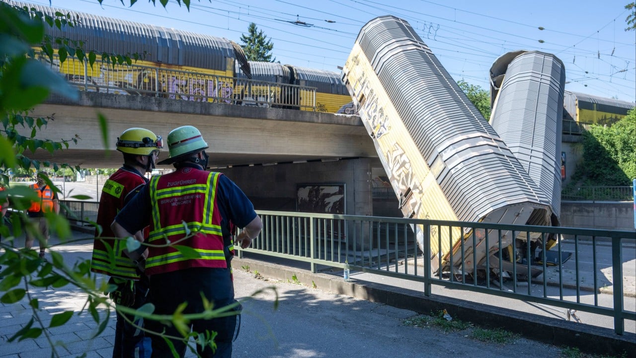 1 killed as freight train plunges from bridge in Germany after crash