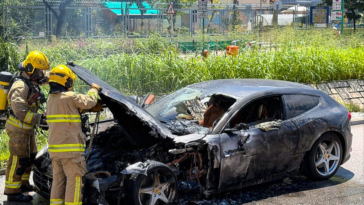 Driver escapes as Ferrari catches fire near Hong Kong light rail stop