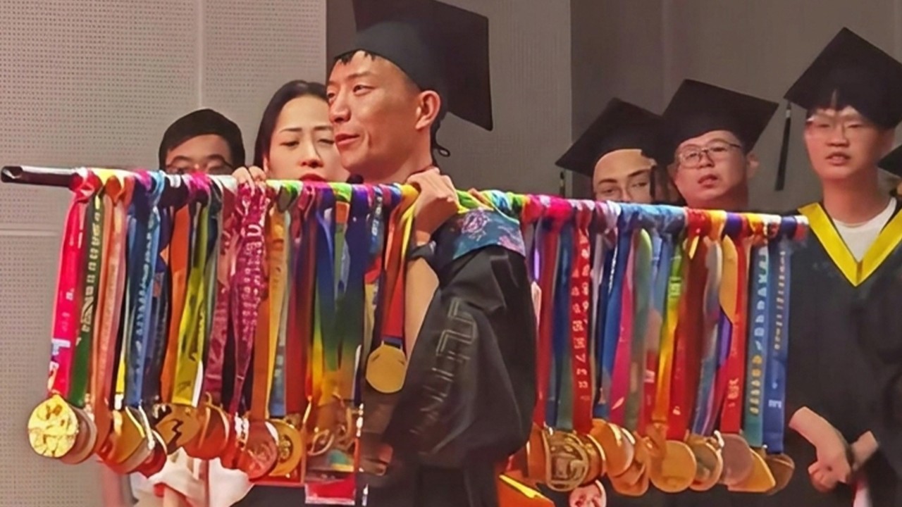 Chinese student displays 70 marathon medals at graduation after running to fund education