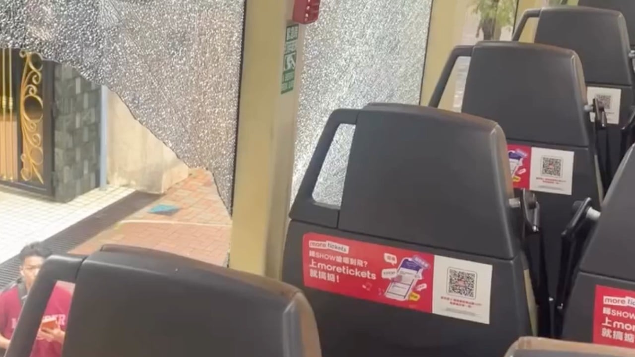 Close call as tree branch hits Hong Kong double-decker bus, smashing window
