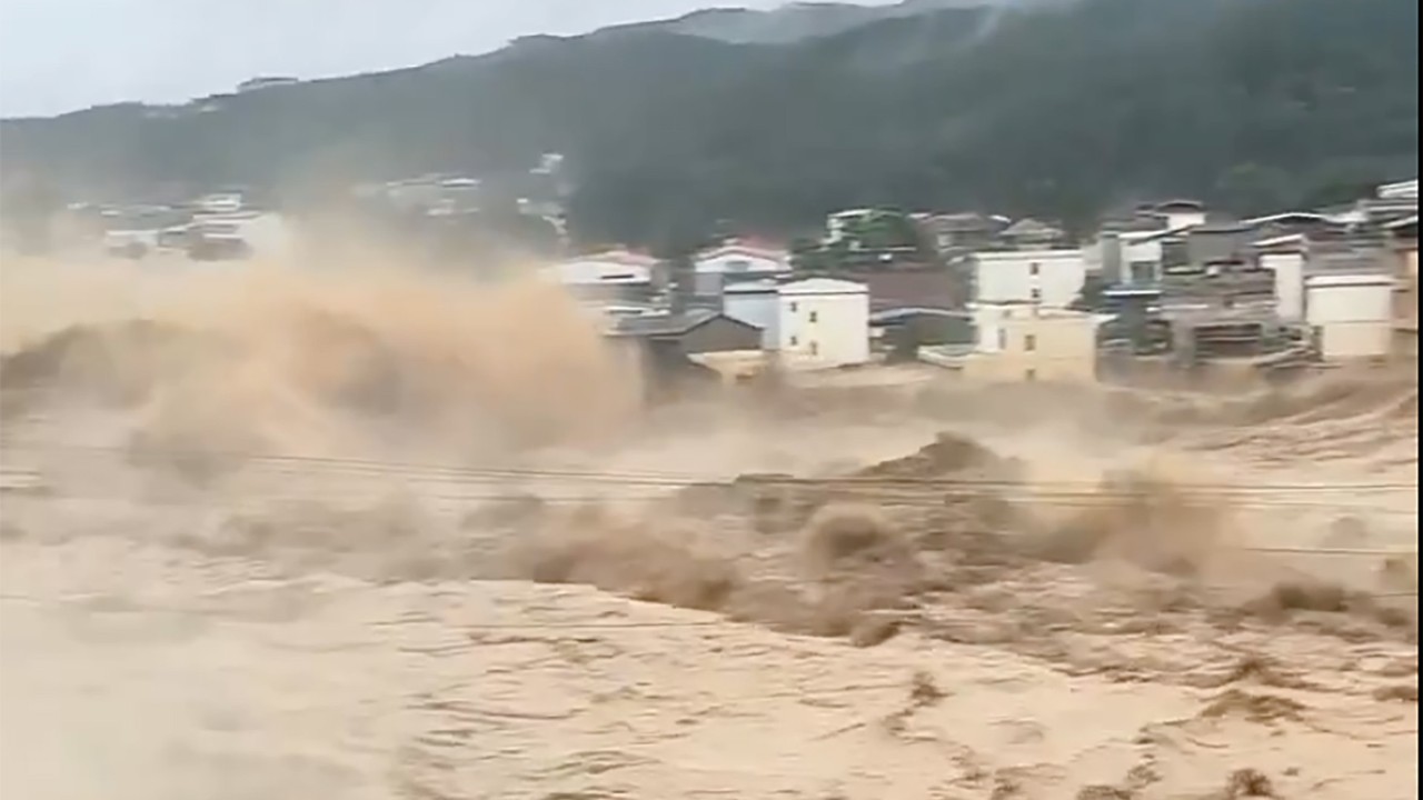 China dam collapse: hundreds evacuated after typhoon rains breach Guangxi reservoir
