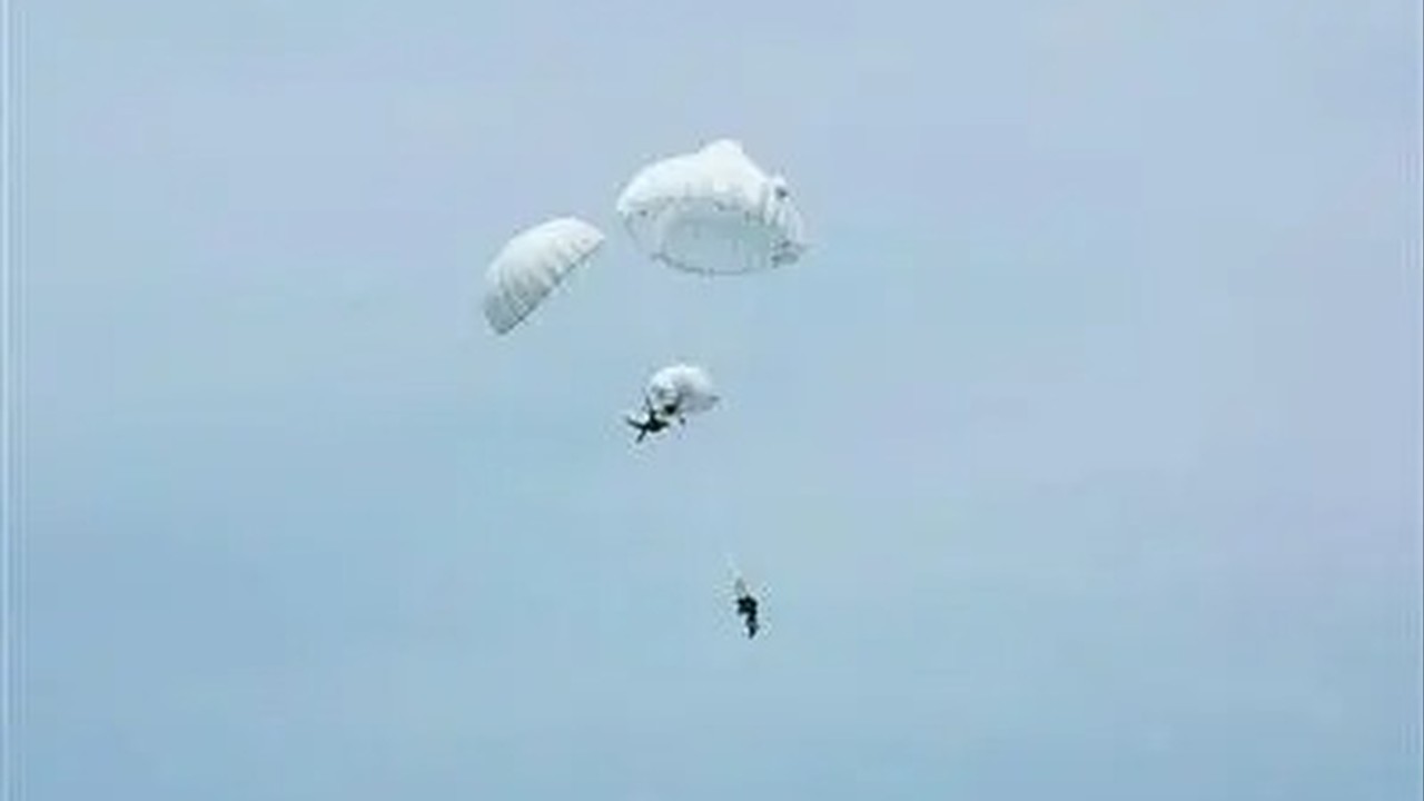 Chinese paratrooper saves unconscious comrade in dramatic mid-air chute emergency
