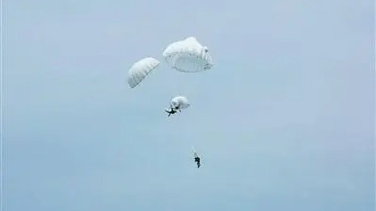 Chinese paratrooper saves unconscious comrade in dramatic mid-air chute emergency