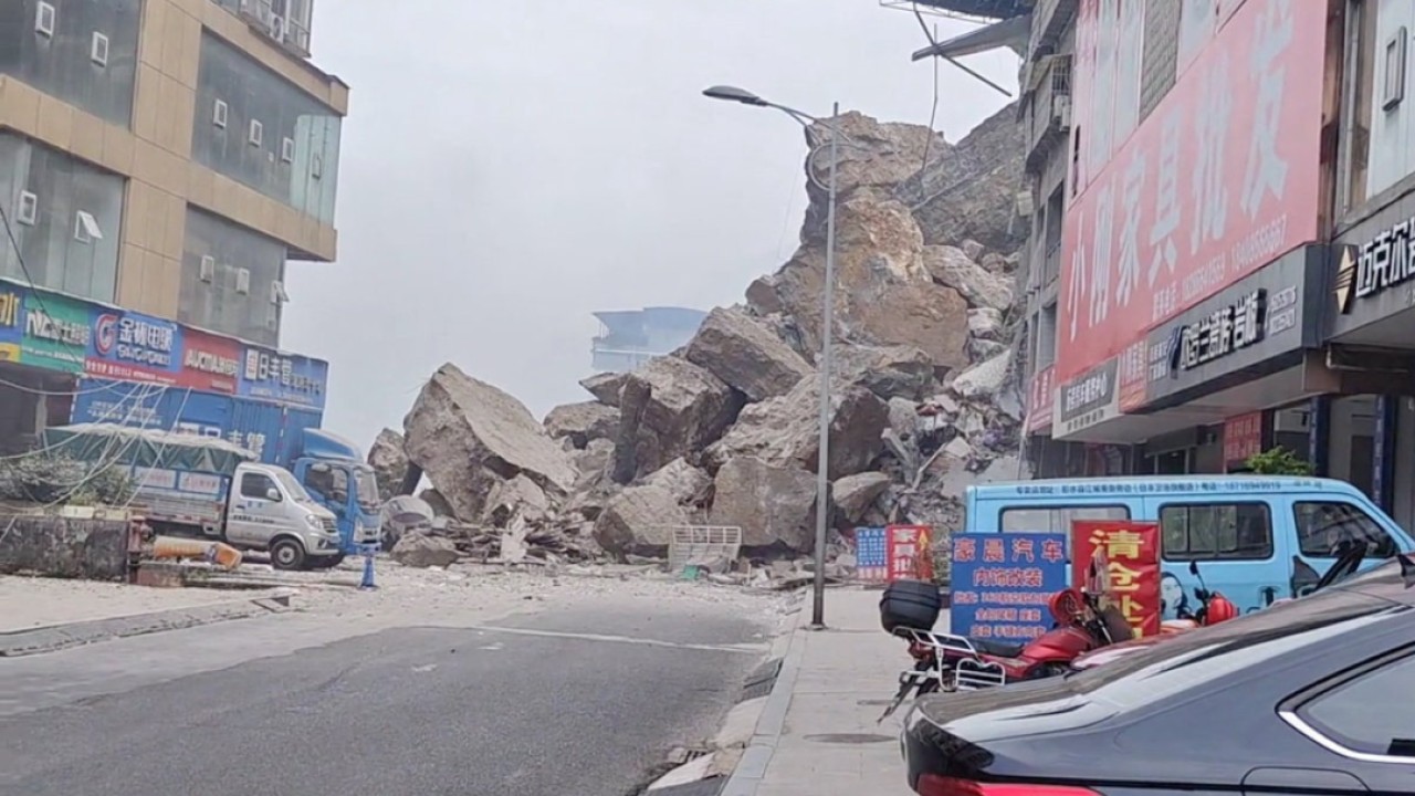 China rescuers race to find trapped people after landslide