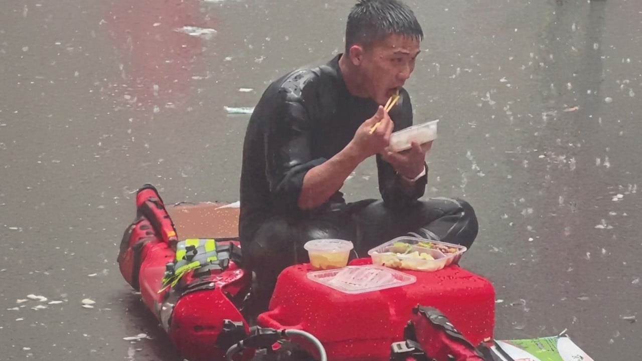 Video capturing Chinese firefighter eating in rain during flood relief goes viral
