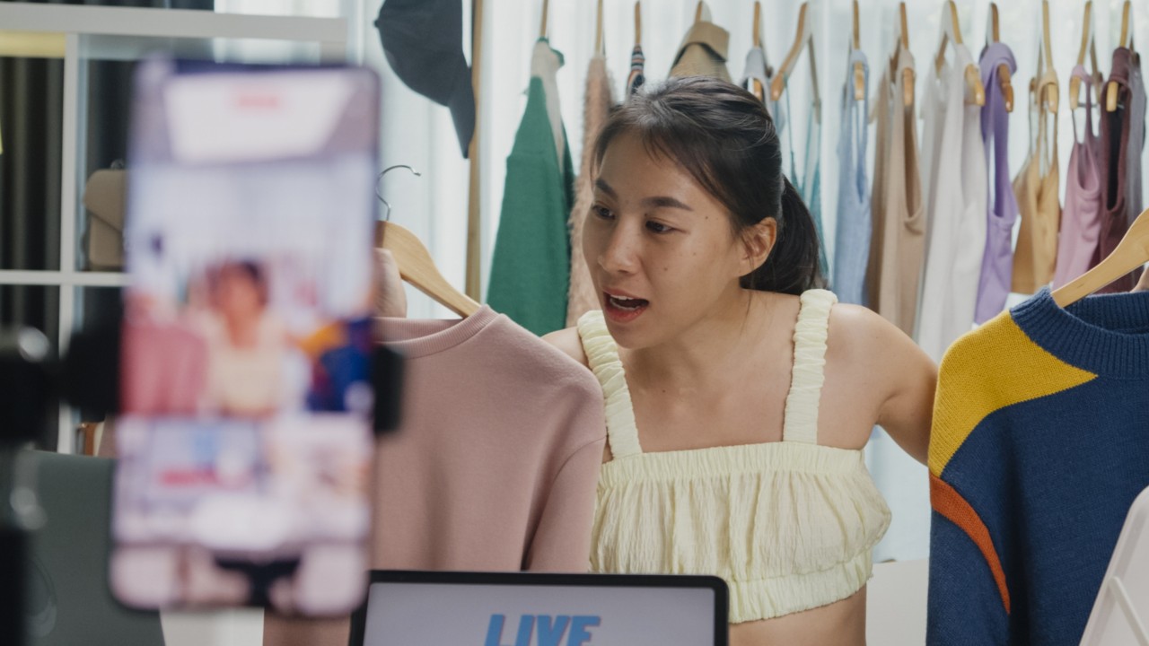 Singapore’s young workers cling to side hustles to survive the AI age: ‘it’s exhausting’