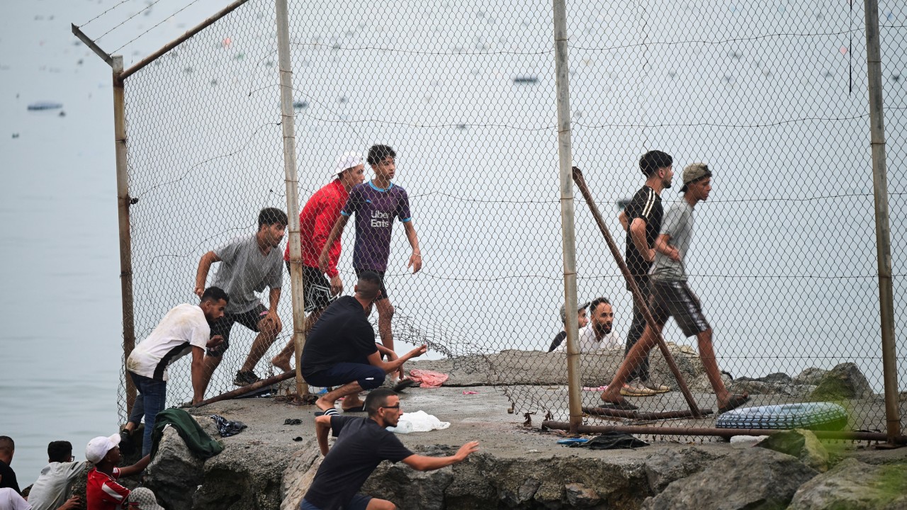 Spain and Morocco move to halt deadly rush on Ceuta after 49,000 migrants cross