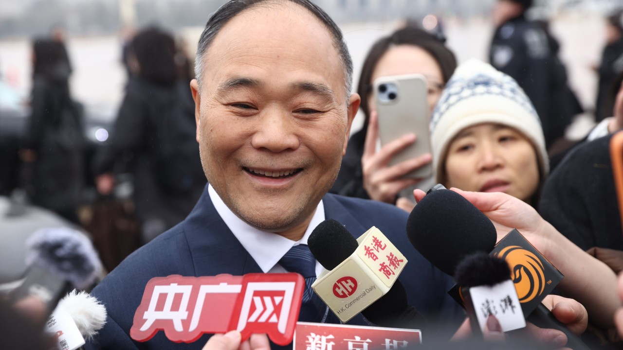 Billionaire Geely Auto head Li Shufu steps down as profit slips