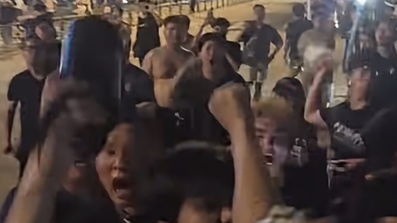 Angry Chinese Super League fans attack visiting team bus and make racist, offensive gestures