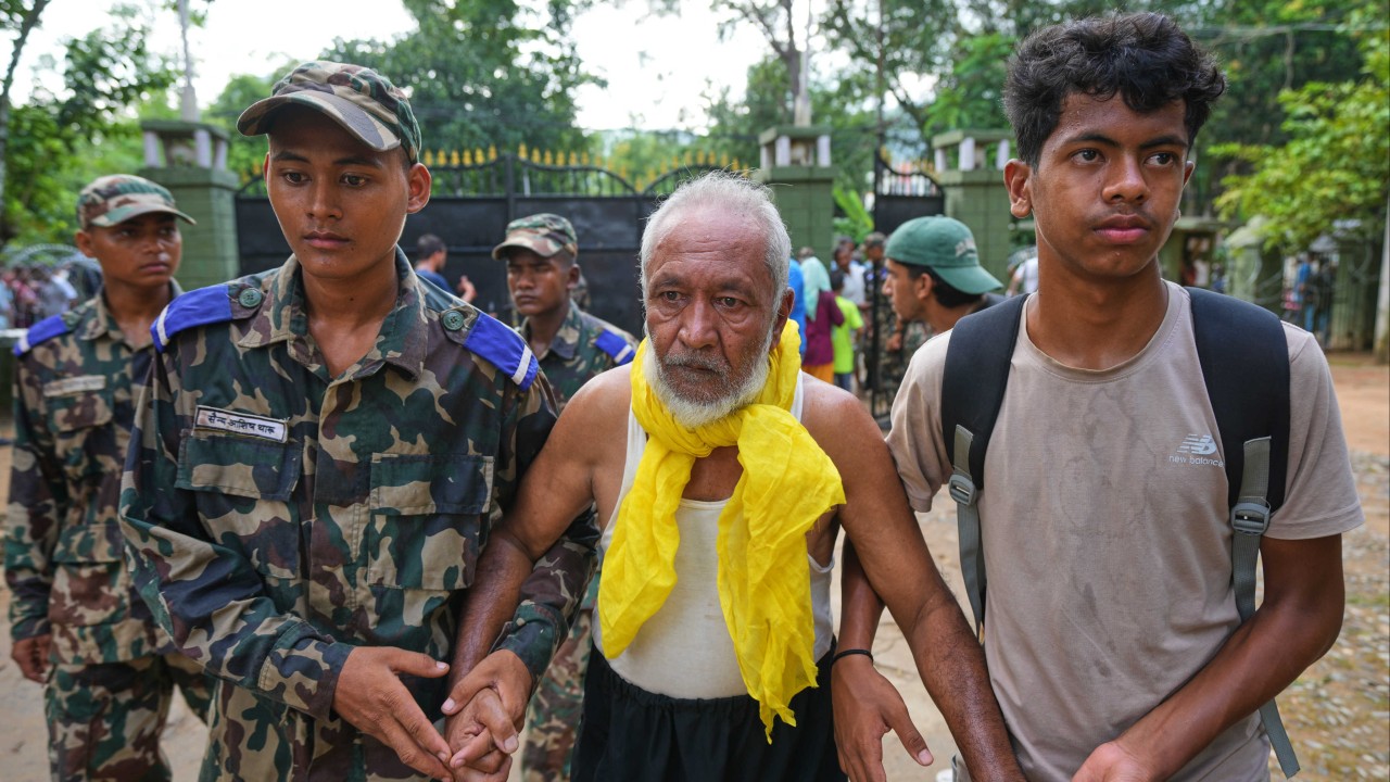 China-Nepal floods: rescuers pull out survivors caked in mud as toll climbs
