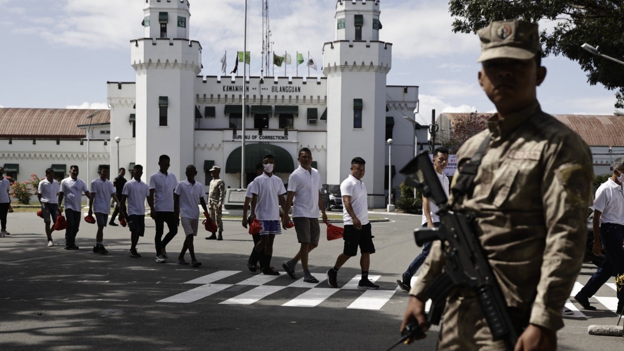 Freed Hongkonger sent back to jail as storm delays deportation from Philippines