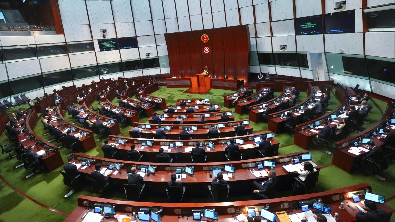 Hong Kong finance chief says economy grew in third quarter, warns of external risks