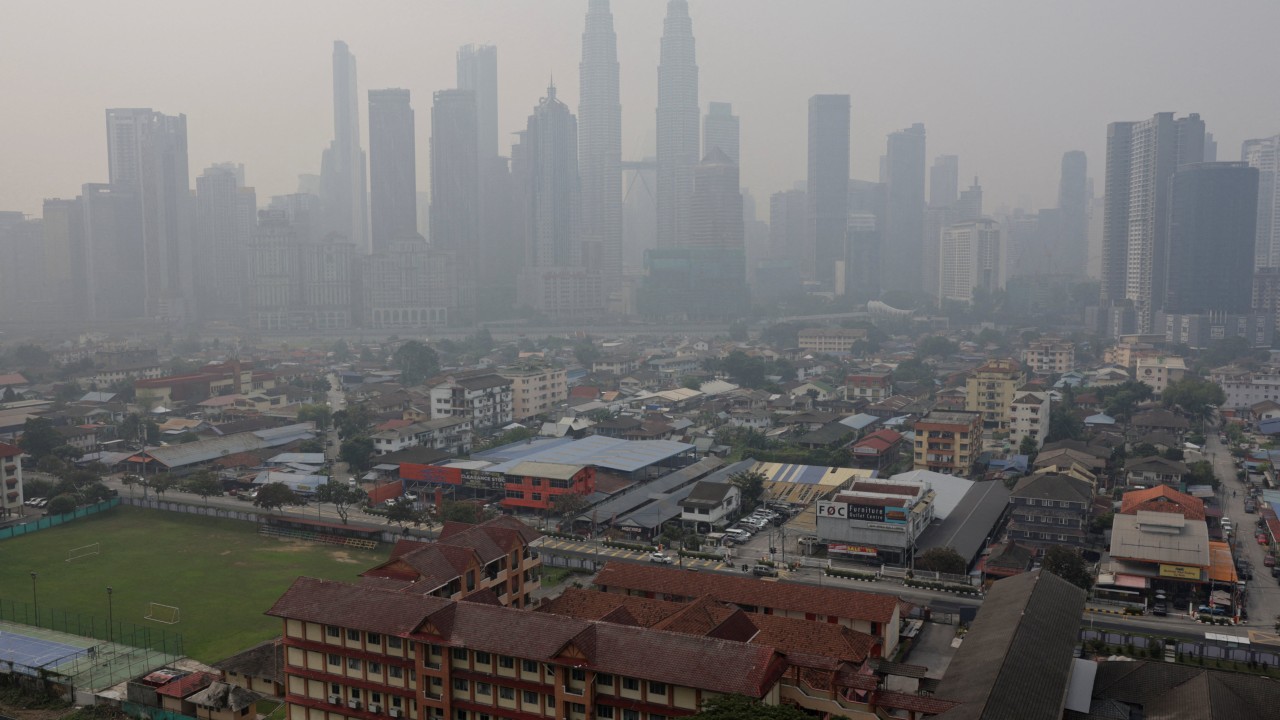 Malaysia urged to police its firms in Indonesia as haze shuts schools