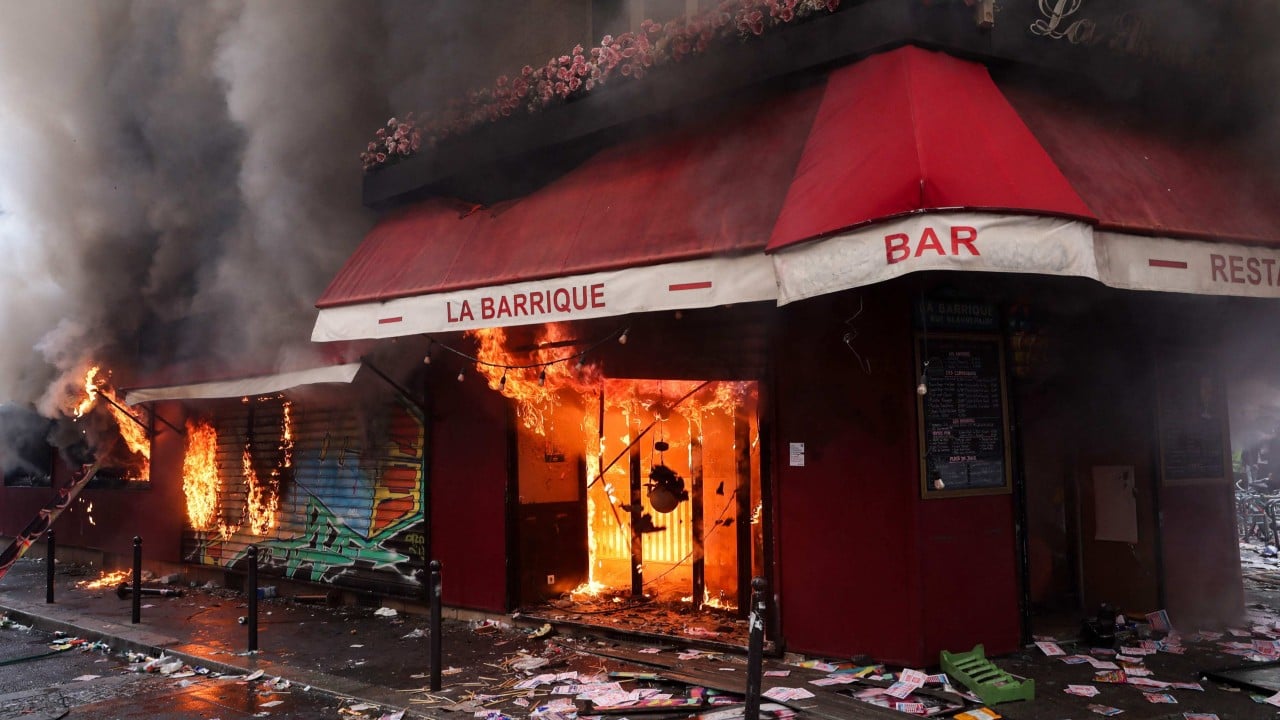 Night of violence lingers over Paris as one Chinese cafe owner counts the costs of protest