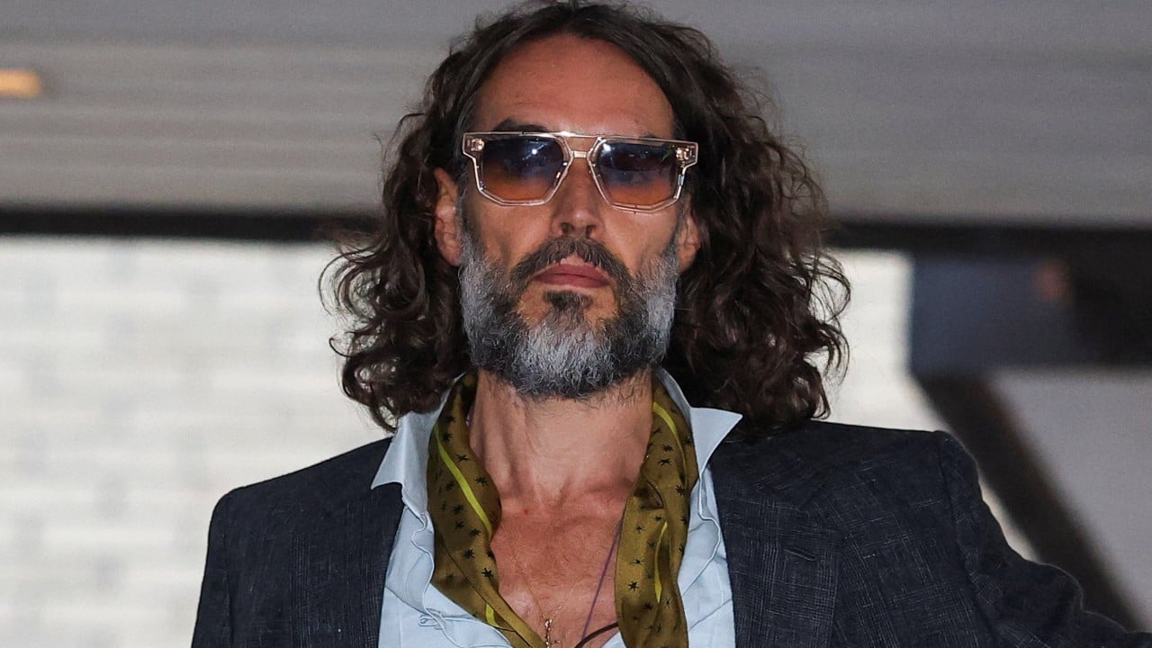 Woman tells UK court Russell Brand dragged her into bar toilet and raped her