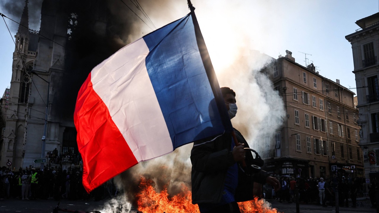 Hong Kong issues amber travel alert for France as school protests turn violent