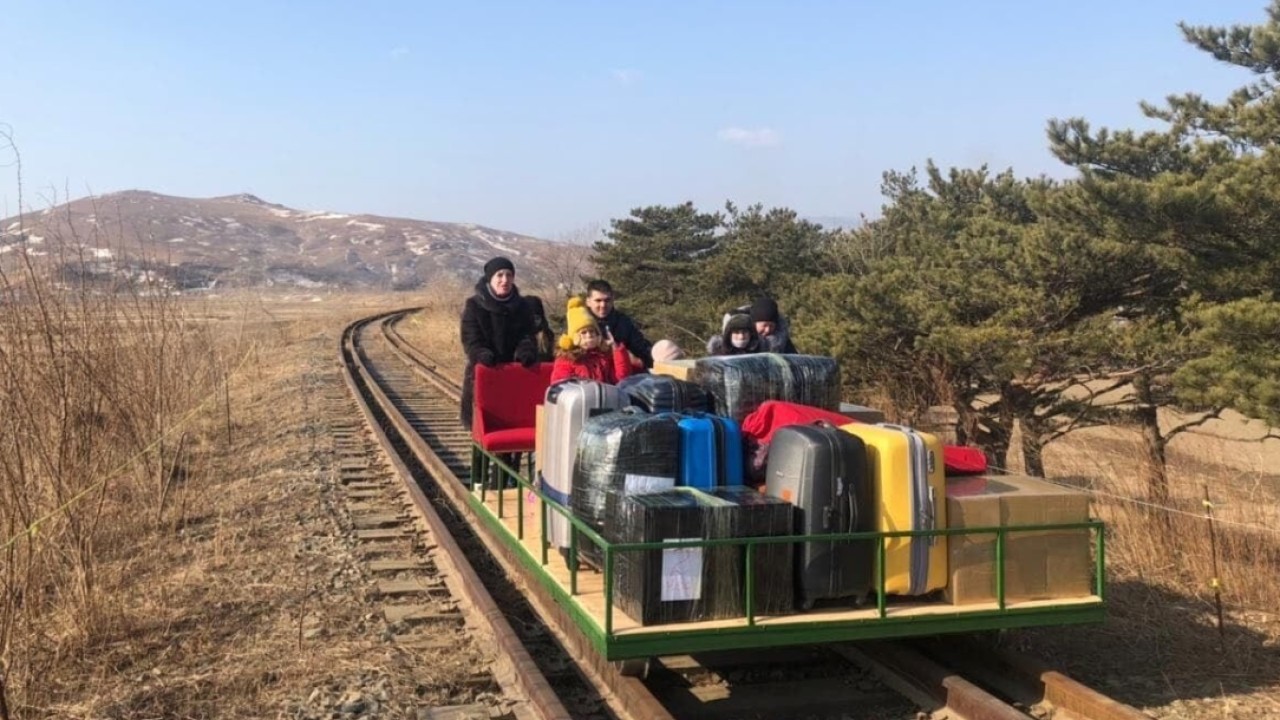 Russian diplomats leave North Korea by pushing themselves over border on rail trolley