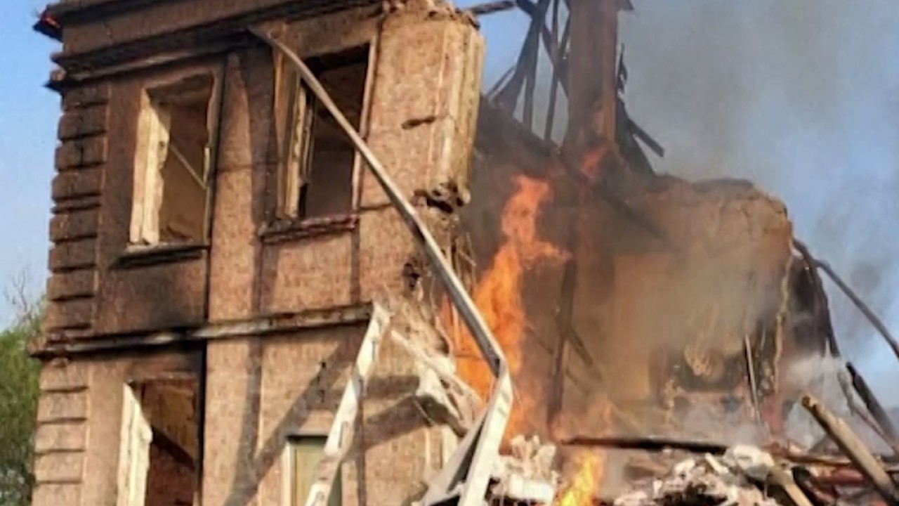 Ukraine war: video shows burning munitions cascading down on Azovstal steel plant
