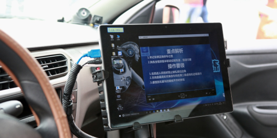 Despite its cool name, RoboCoach doesn’t look like RoboCop sitting in the passenger seat. (Picture: Beijing Yi Jia Jia Technology)