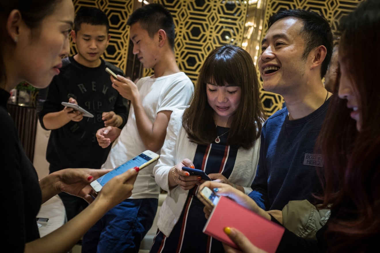 Many work events in China now end with ritual QR code scanning. (Liu Xingzhe/EPA)