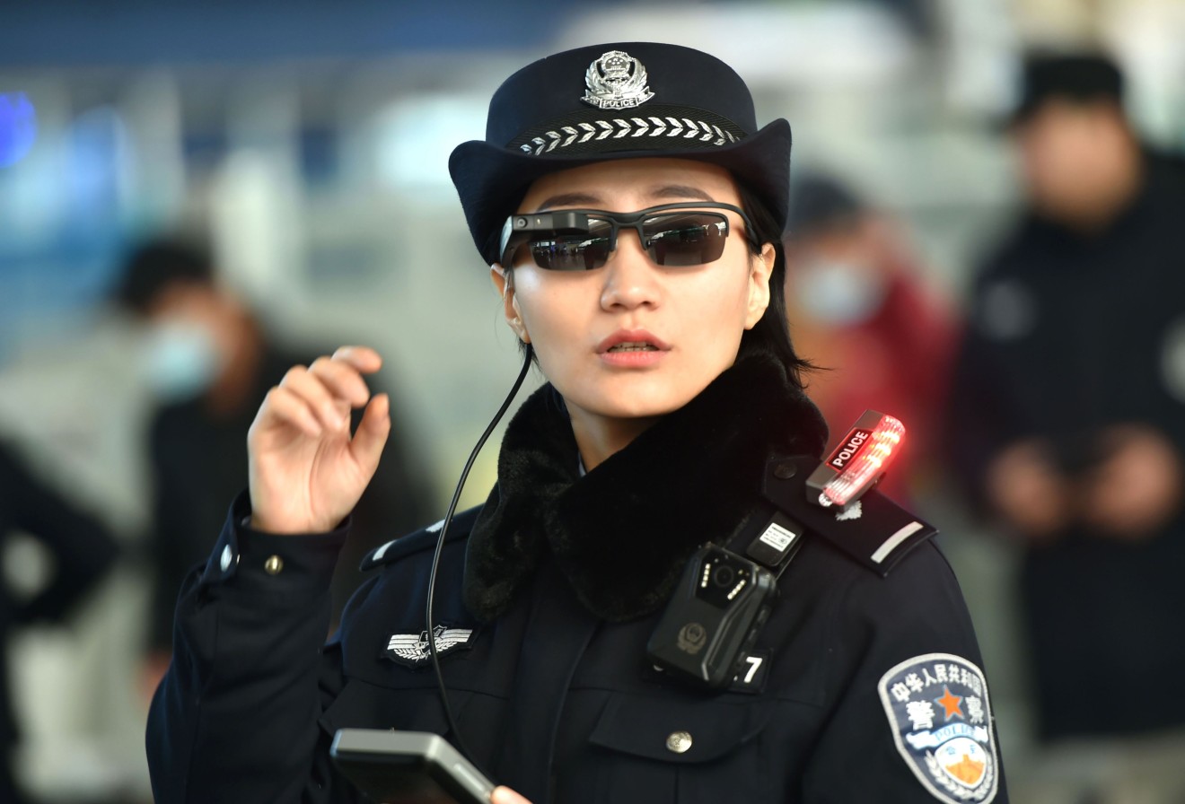 China has become the home of futuristic tech such as this facial recognition eyewear worn by police in Zhengzhou, China. (Picture: AFP)