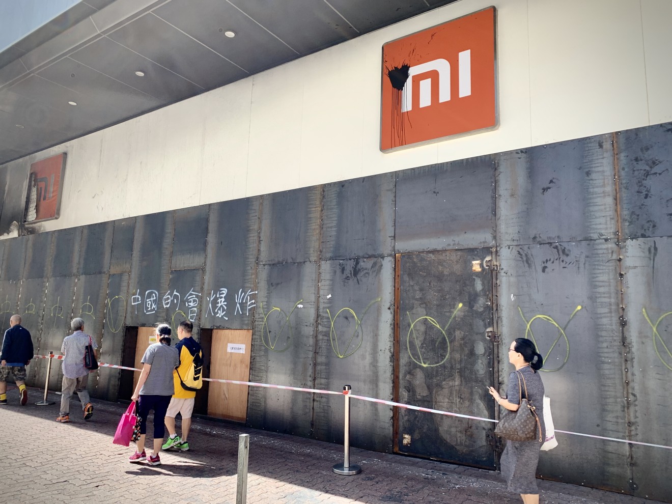 “China’s will explode,” reads one piece of grammatically perplexing graffiti on the wall of Xiaomi’s Mi Home store in Mong Kok. (Picture: Abacus)