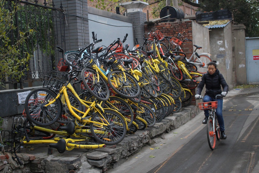 Piles of abandoned shared bikes seen at a hutong in Beijing in 2017. (Picture: Reuters)