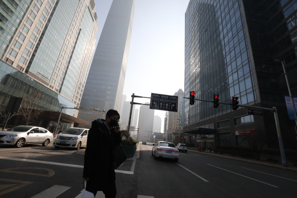 The streets in Beijing's central business district are noticeably quieter than before the coronavirus epidemic. (Picture: SCMP)