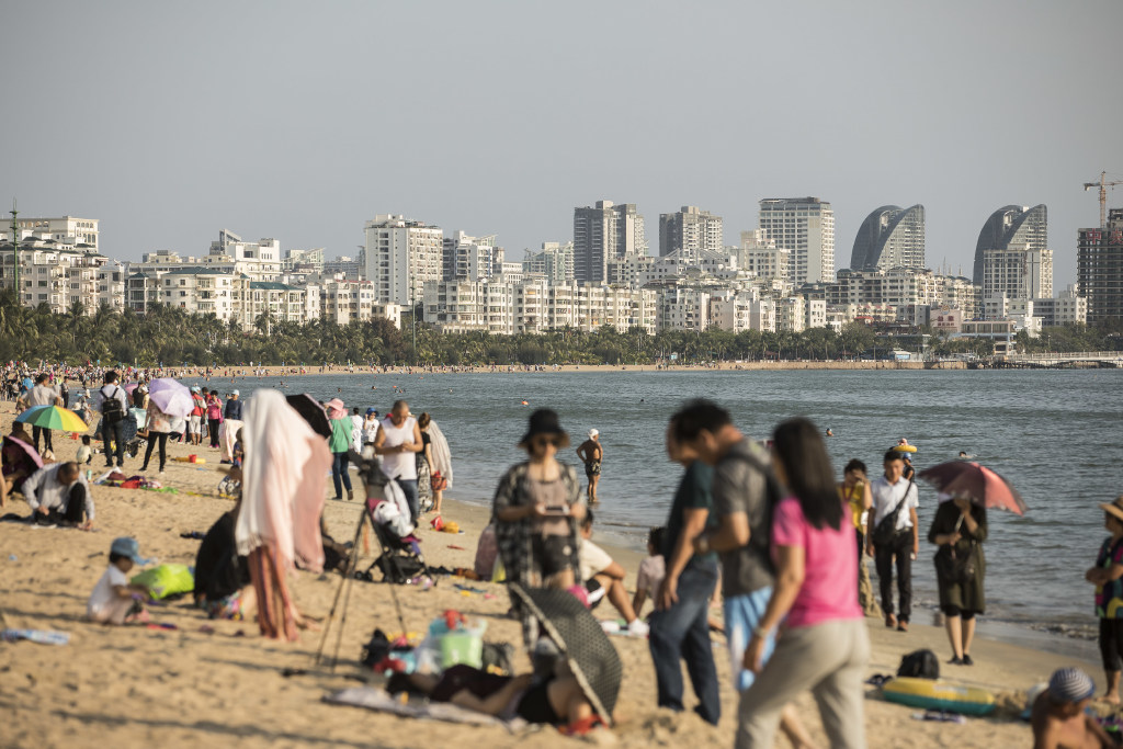 Beachgoers in Sanya, a third-tier city in China. (Picture: Qilai Shen/Bloomberg)