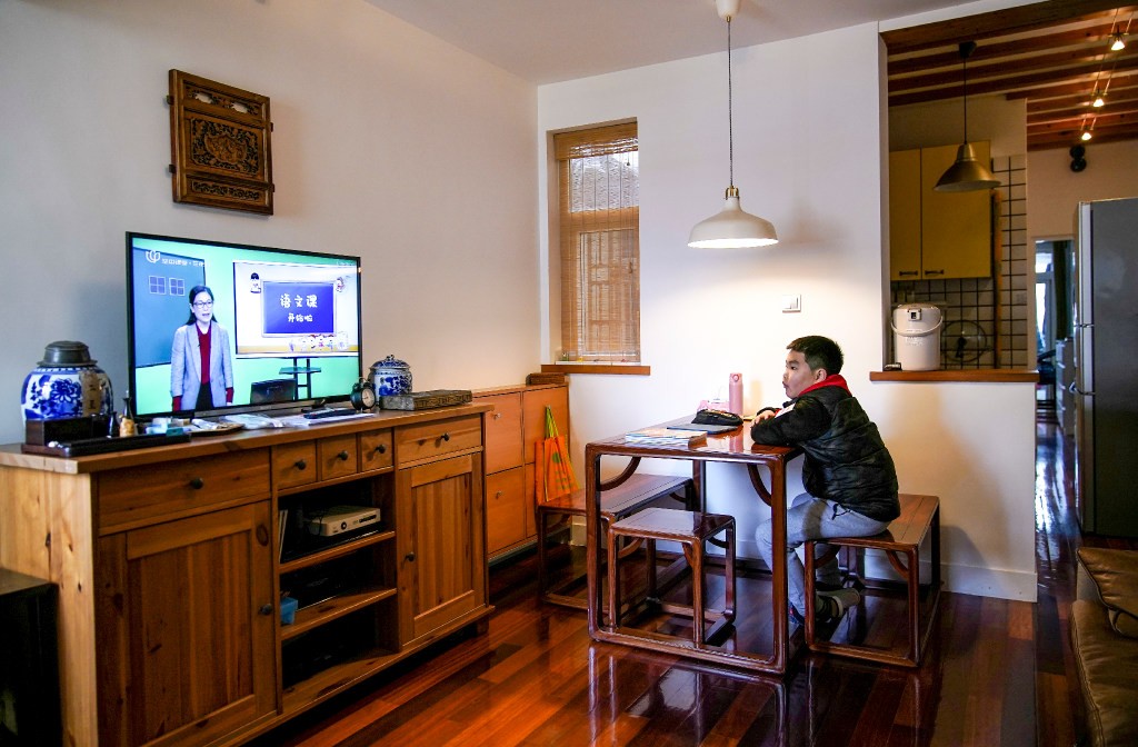 Sha Jie, a 10-year-old primary school student, attends an online Chinese class as he sits at home during the coronavirus outbreak in Shanghai on March 3.(Picture: Reuters)