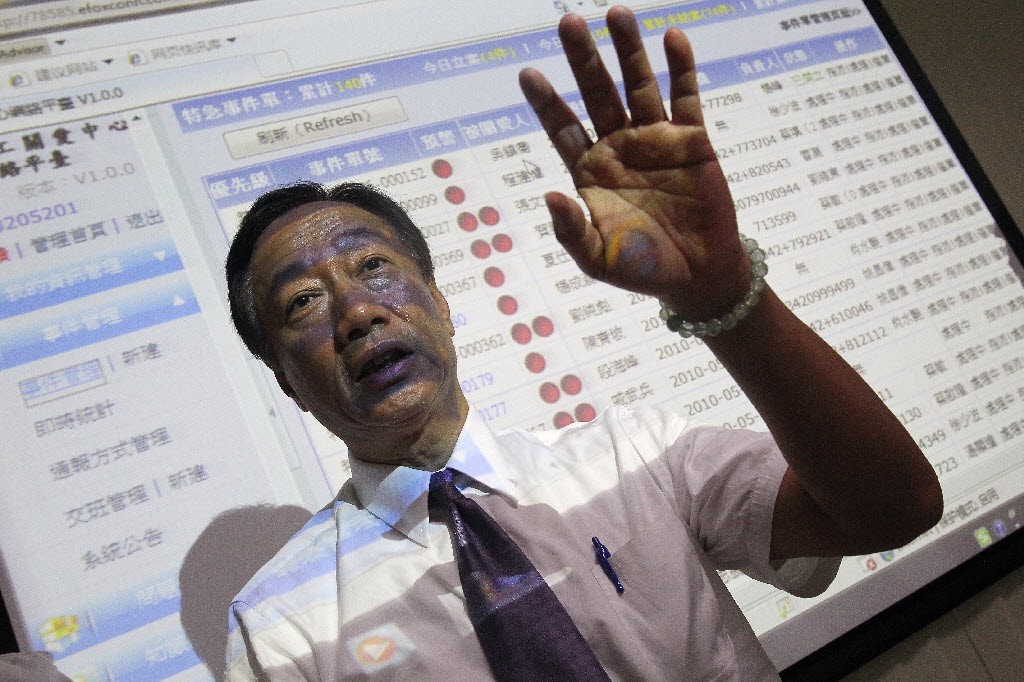 Terry Gou responds to reporters in May 2010 during a media tour at Foxconn’s Shenzhen factory complex following several worker suicides. (Picture: South China Morning Post)